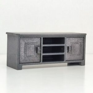 Mueble bajo de color gris con puertas