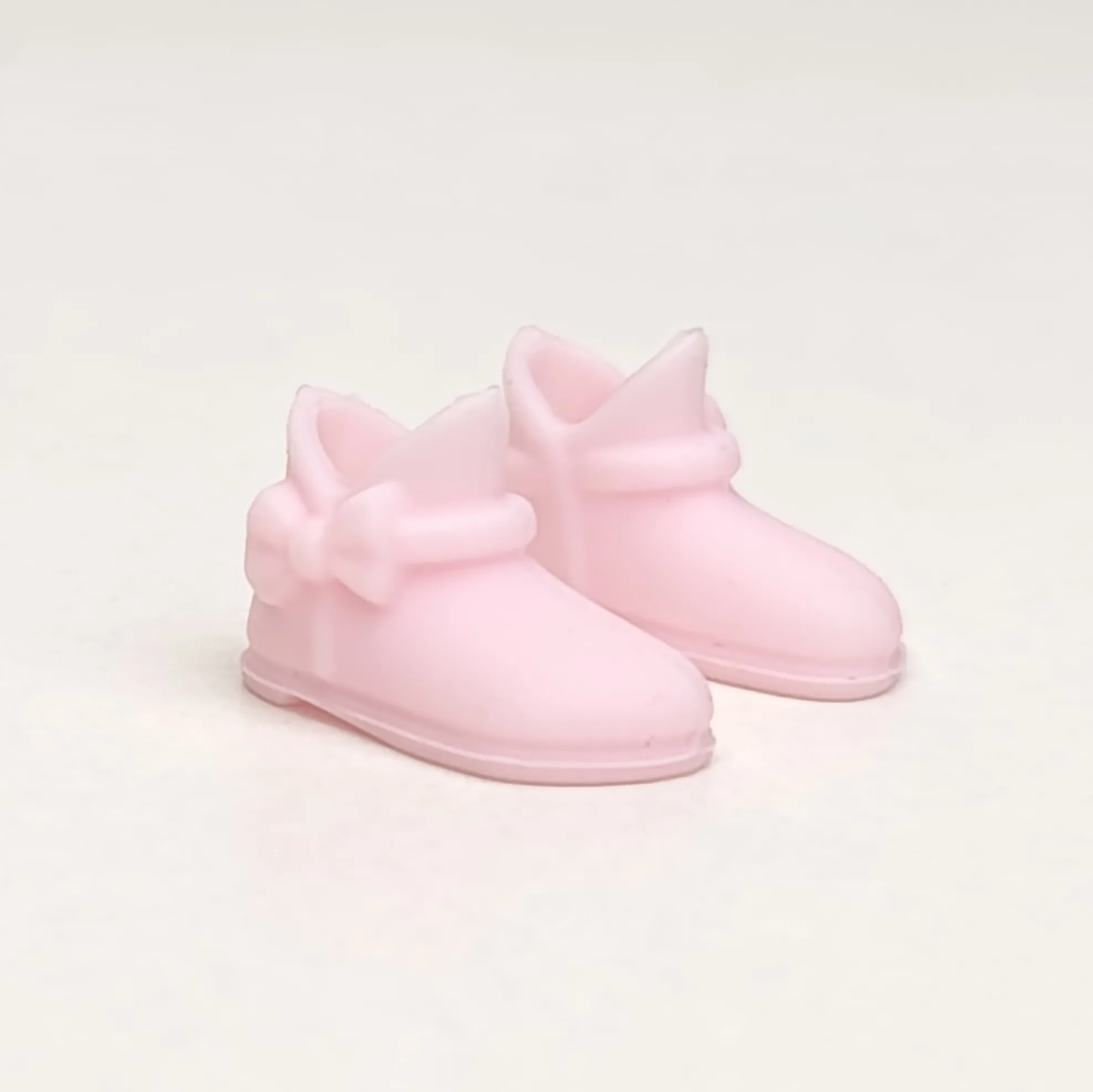Par de botas de color rosa claro