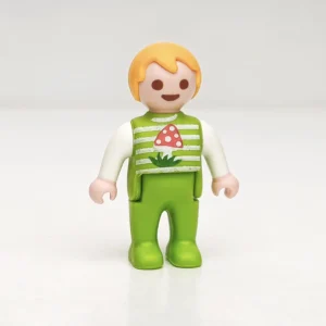 Bebé rubio con vestido verde y seta